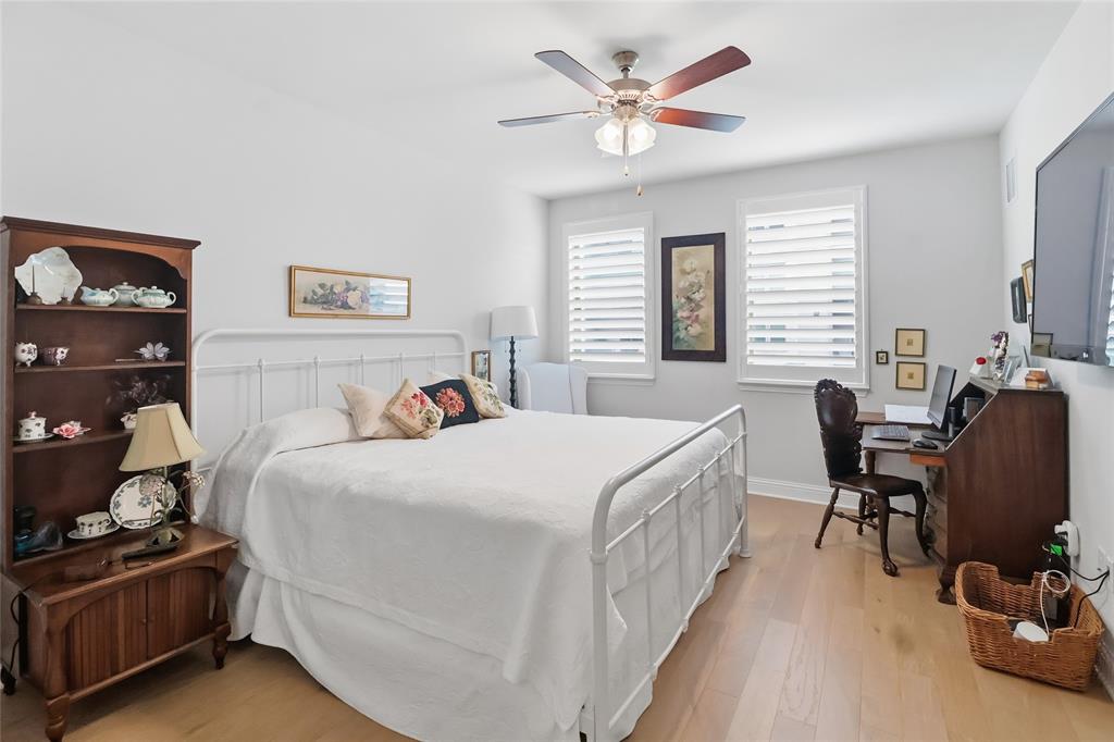 651 Watters Road, Unit 8202 Allen, TX 75013 - Photo 14 of 32 a bedroom with a bed and a desk
