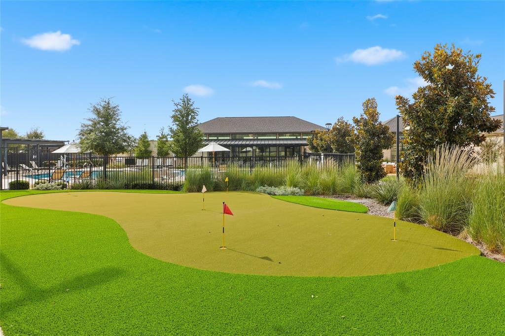 651 Watters Road, Unit 8202 Allen, TX 75013 - Photo 31 of 32 a view of a swimming pool with an outdoor space and seating area