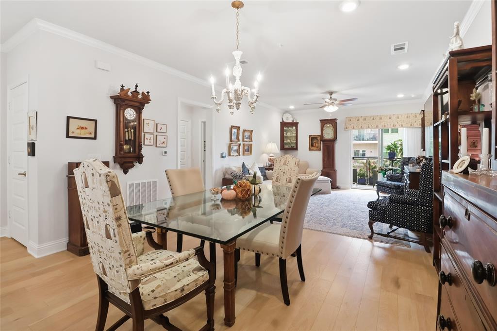 651 Watters Road, Unit 8202 Allen, TX 75013 - Photo 6 of 32 a view of a dining room with furniture and a chandelier