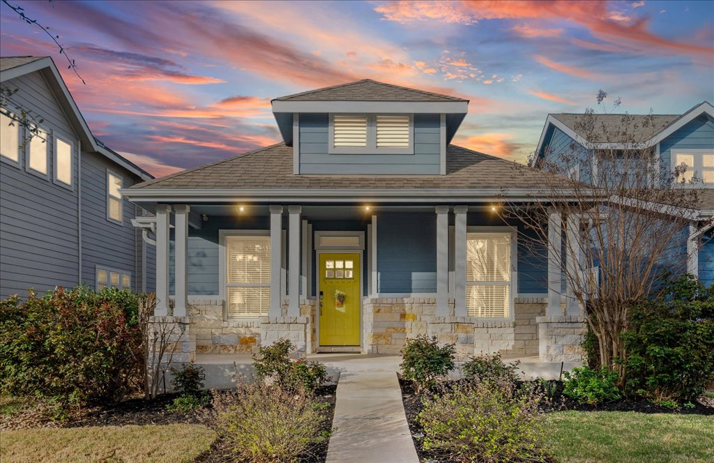 5912 Corrine Lane Austin, TX 78747 - Photo 25 of 27 Bungalow Style Home featuring covered porch, stone siding, and a shingled roof