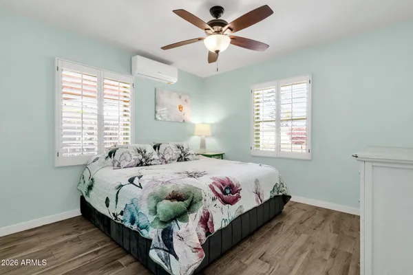 a bedroom with a bed and a window