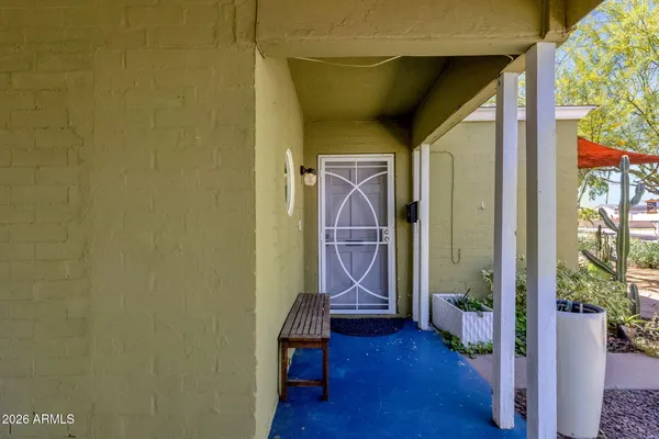 a view of a living room with a bed and furniture