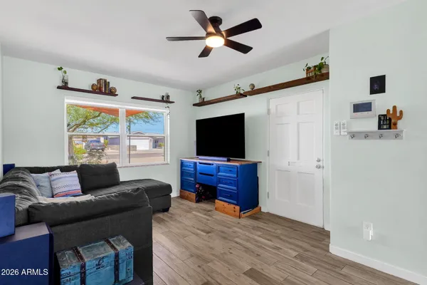 a living room with furniture and a flat screen tv