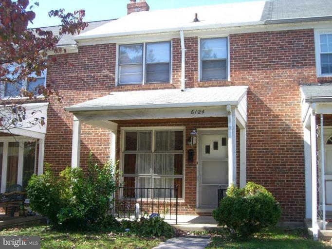 6124 Marlora Road Baltimore, MD 21239 - Photo 1 of 12 a front view of a house with plants