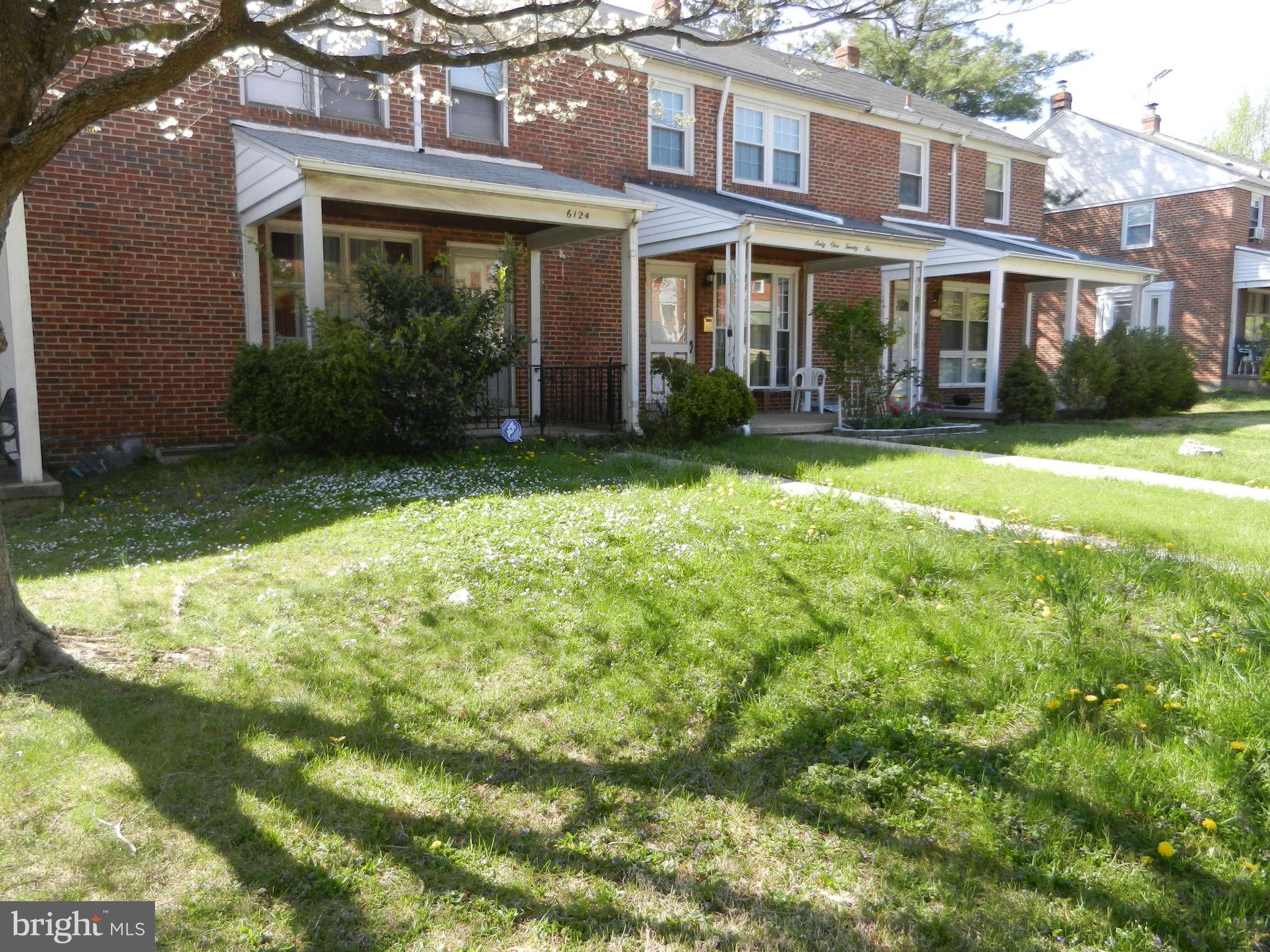 6124 Marlora Road Baltimore, MD 21239 - Photo 12 of 12 a front view of a house with garden