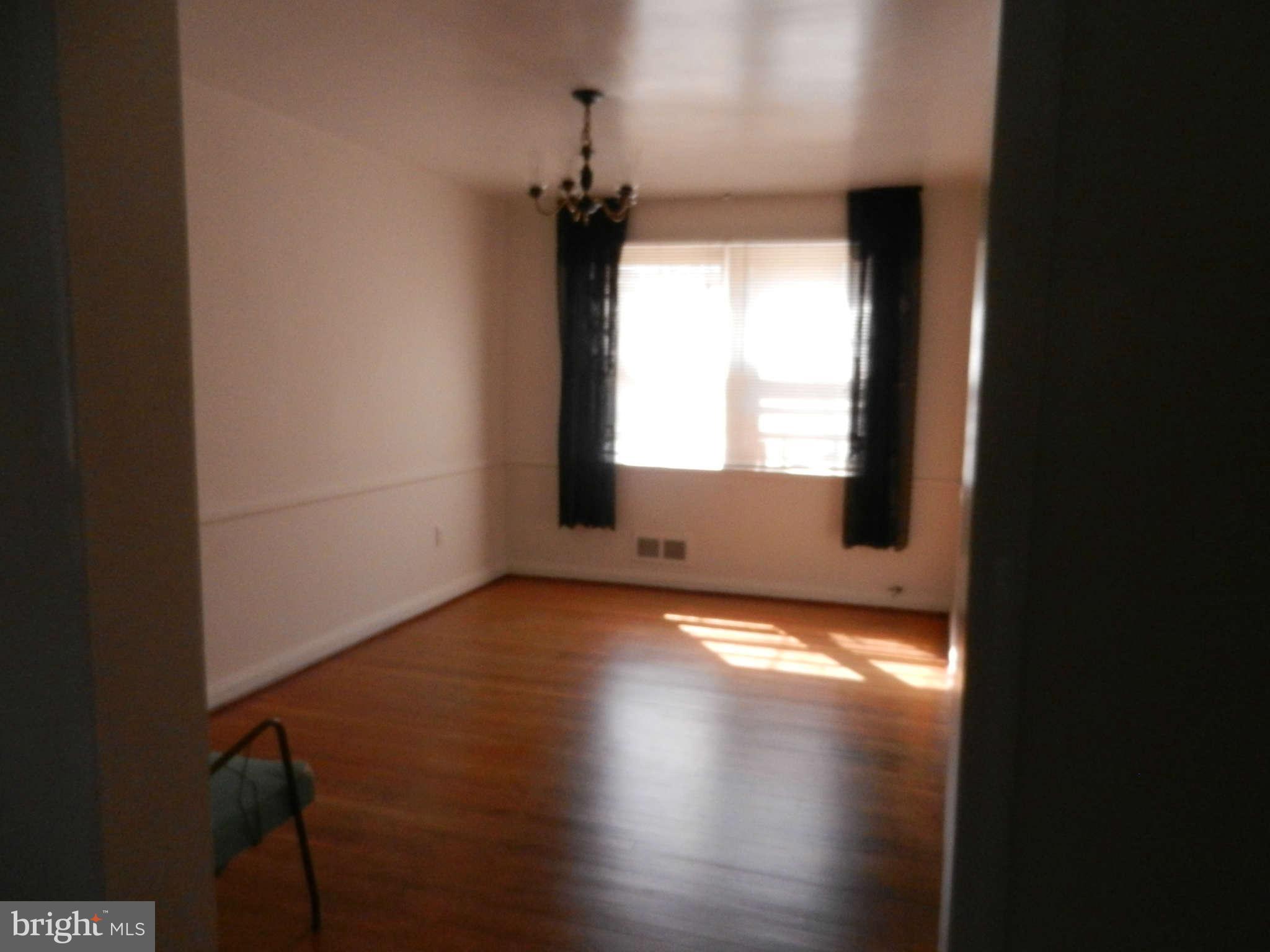 6124 Marlora Road Baltimore, MD 21239 - Photo 4 of 12 a view of an empty room and window