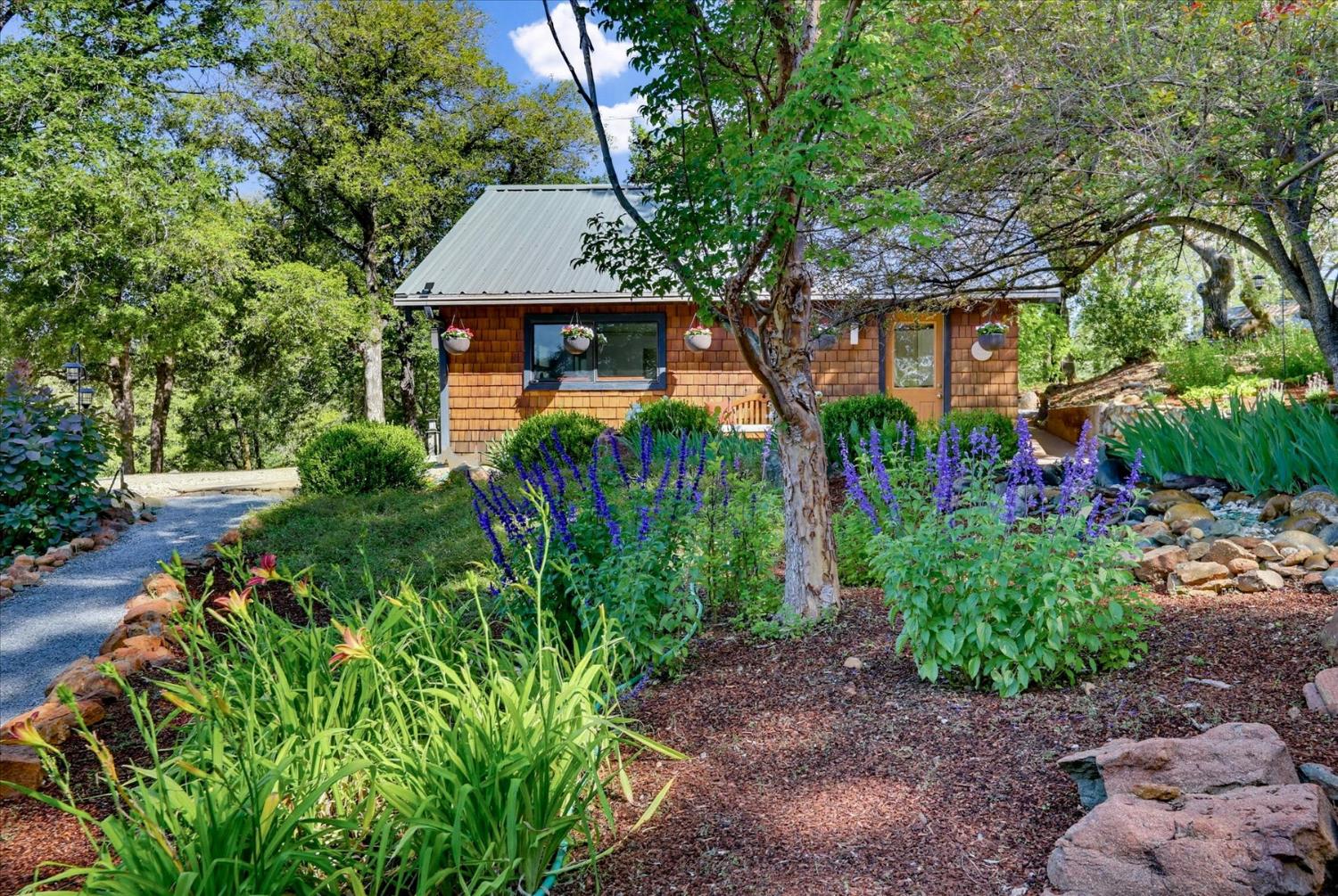 20111 Tanglewood Road Grass Valley, CA 95945 - Photo 77 of 93 a front view of a house with garden