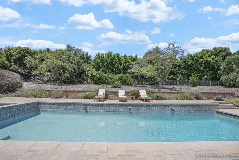 a view of swimming pool with a yard