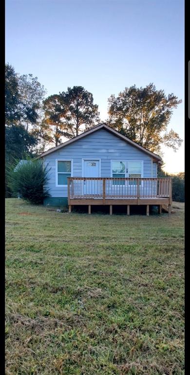 4801 Delano Road Atlanta, GA 30349 - Photo 1 of 1 a view of a house with a garden