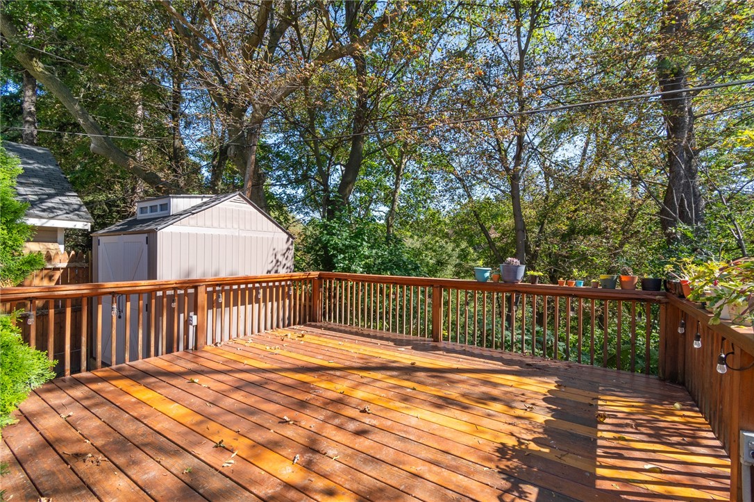 235 Wildmere Road Irondequoit, NY 14617 - Photo 3 of 41 The deck that overlooks the GREEN SPACE in the rear yard! So much natural beauty here! Watch the deer roam! This address allows FREE RANGE CHICKENS - there’s a coop behind the garage!