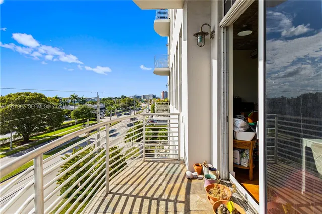 a bedroom with a bed and a mirror