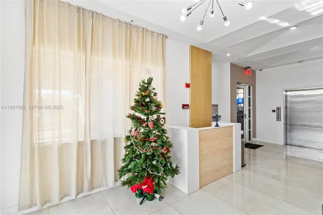 a view of dining room with furniture and floor to ceiling window