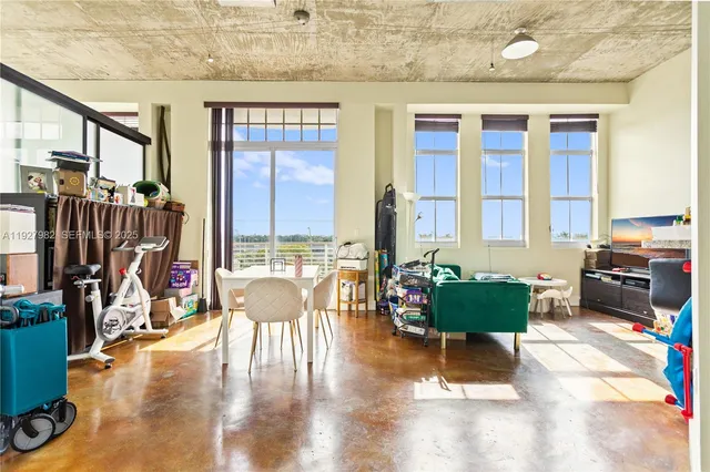 a view of living room with furniture and a flat screen tv