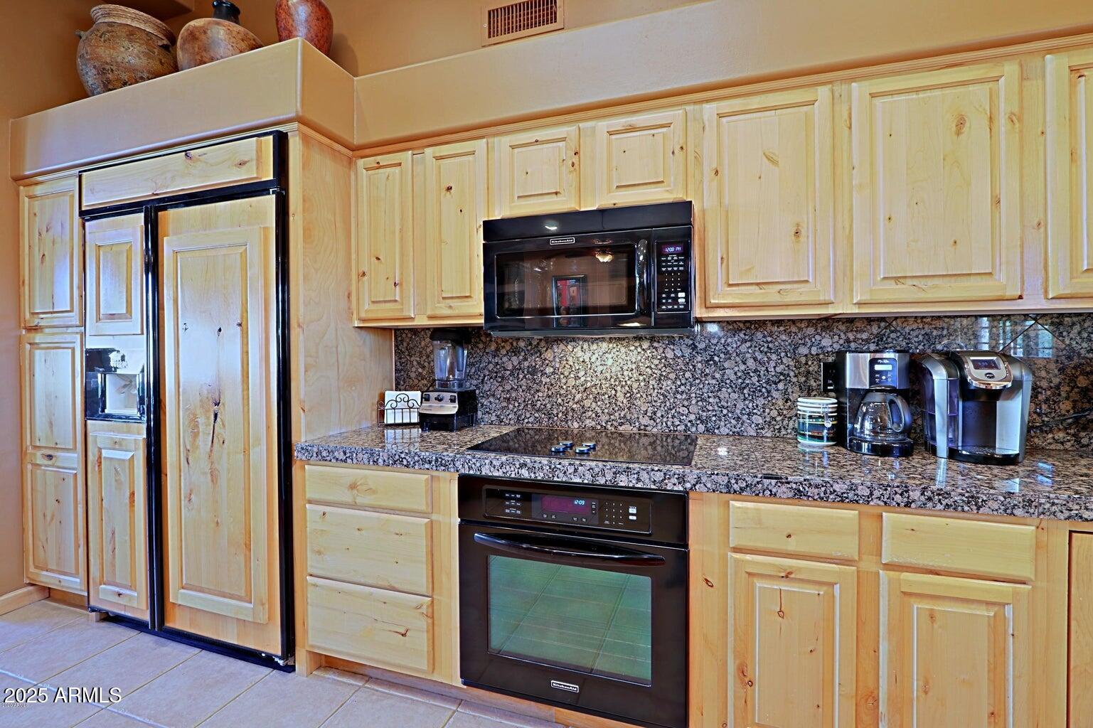 15320 East Skinner Drive Scottsdale, AZ 85262 - Photo 12 of 21 a kitchen with granite countertop a sink cabinets and stainless steel appliances