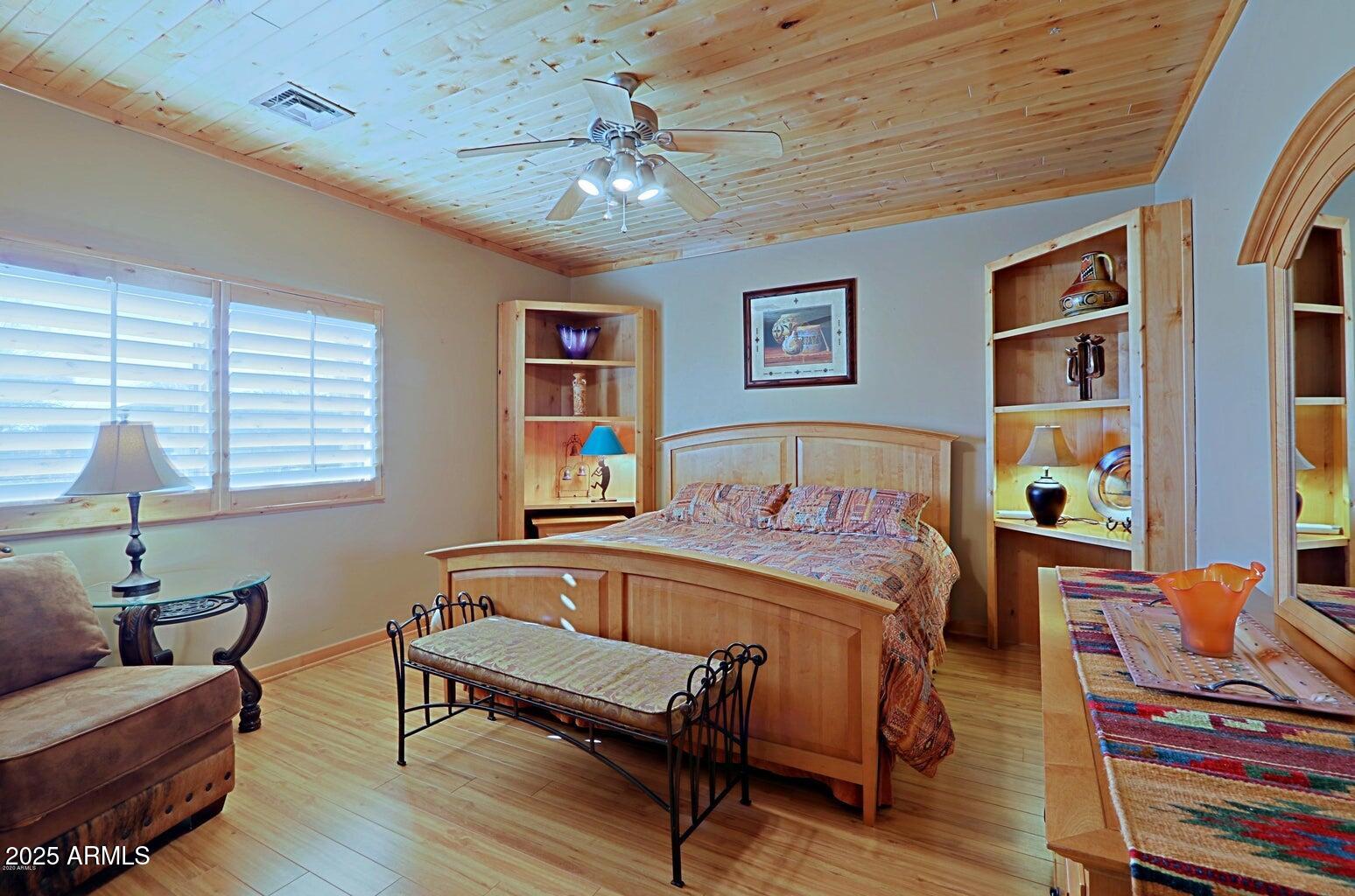 15320 East Skinner Drive Scottsdale, AZ 85262 - Photo 16 of 21 a spacious bedroom with a bed and a couch