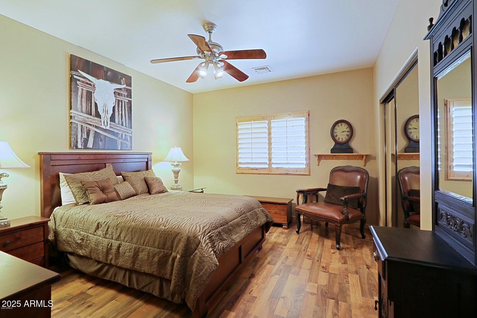 15320 East Skinner Drive Scottsdale, AZ 85262 - Photo 18 of 21 a bedroom with bed and wooden floor