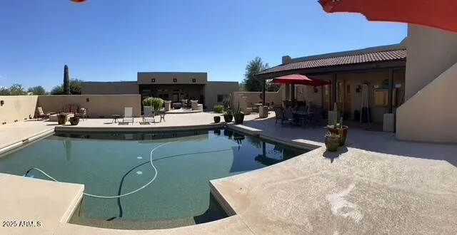 a room with lots of appliances and cabinets
