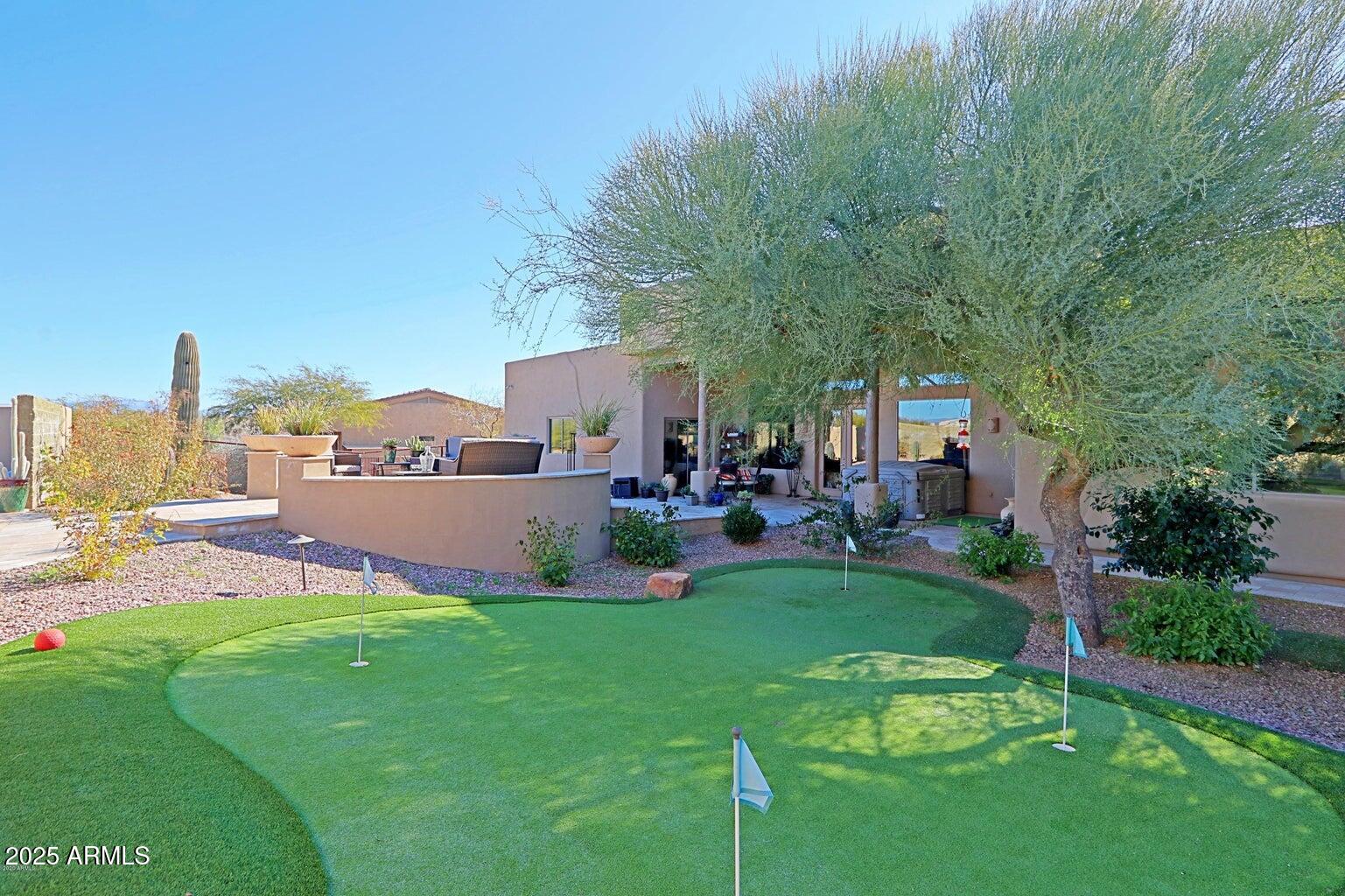 15320 East Skinner Drive Scottsdale, AZ 85262 - Photo 5 of 21 a view of a patio with couches and a table and chairs with garden view