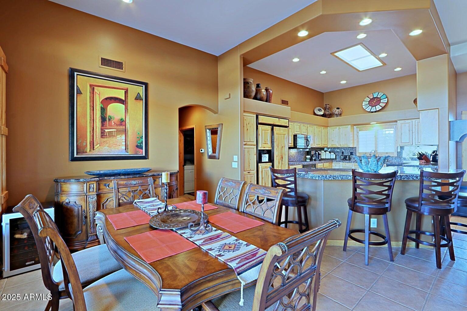 15320 East Skinner Drive Scottsdale, AZ 85262 - Photo 10 of 21 a dining room with a table and chairs