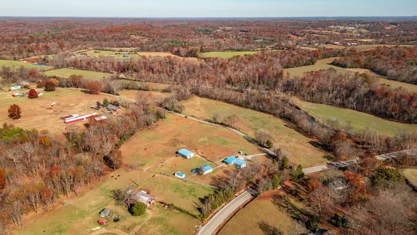 an aerial view of residential house and lake