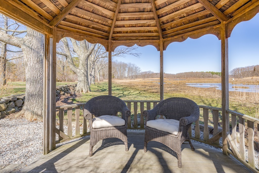 134 Argilla Road Ipswich, MA 01938 - Photo 6 of 10 a living room with furniture and a floor to ceiling window