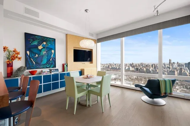a view of a livingroom with furniture and a flat screen tv