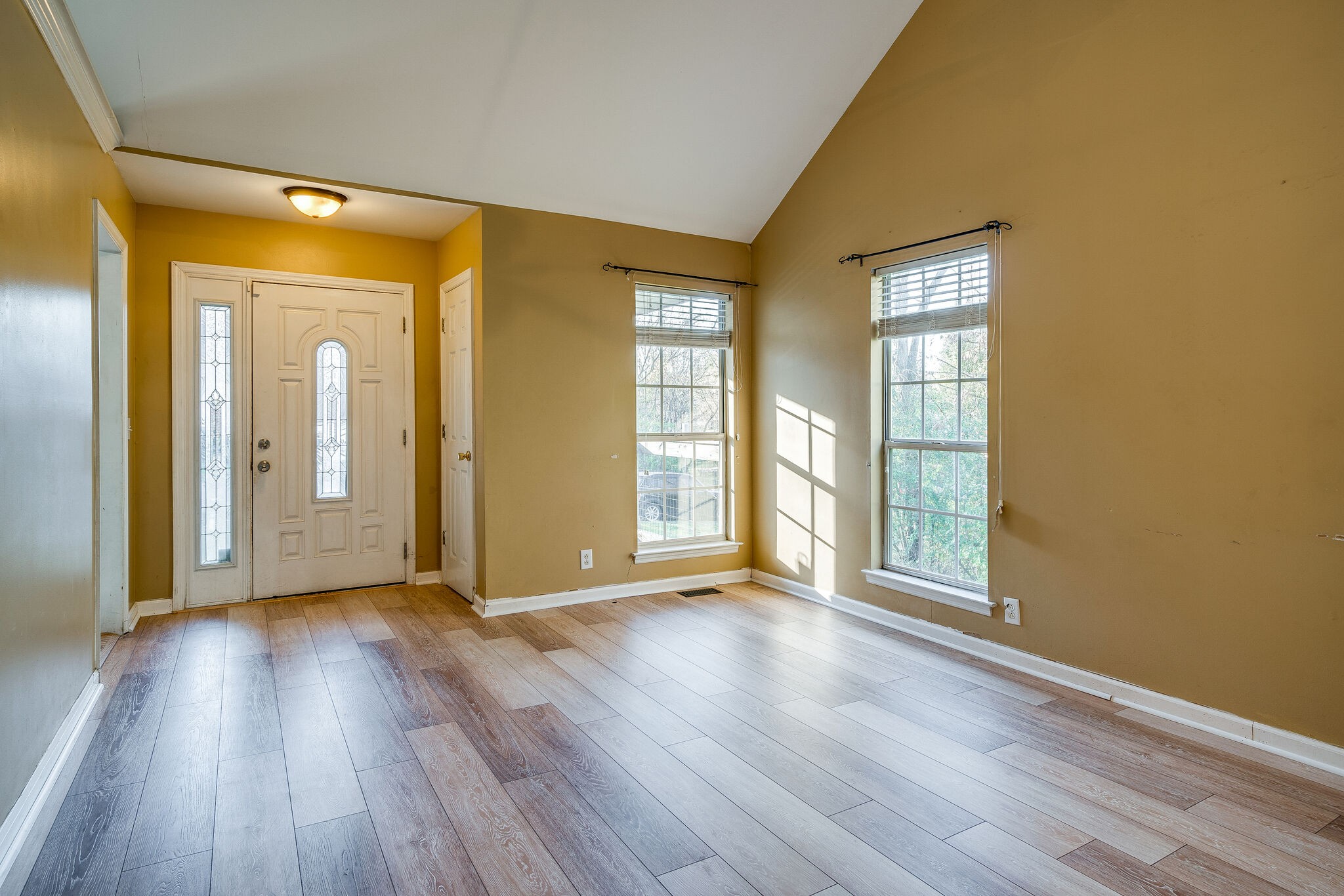 2302 Rader Ridge Road Antioch, TN 37013 - Photo 5 of 19 a view of an empty room with glass door and wooden floor