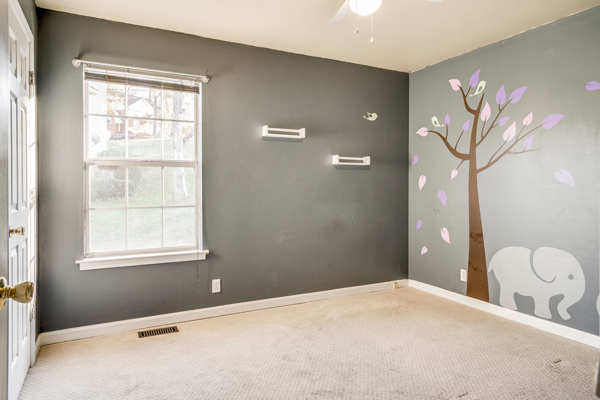 2302 Rader Ridge Road Antioch, TN 37013 - Photo 10 of 19 a bedroom with a bed and a chandelier