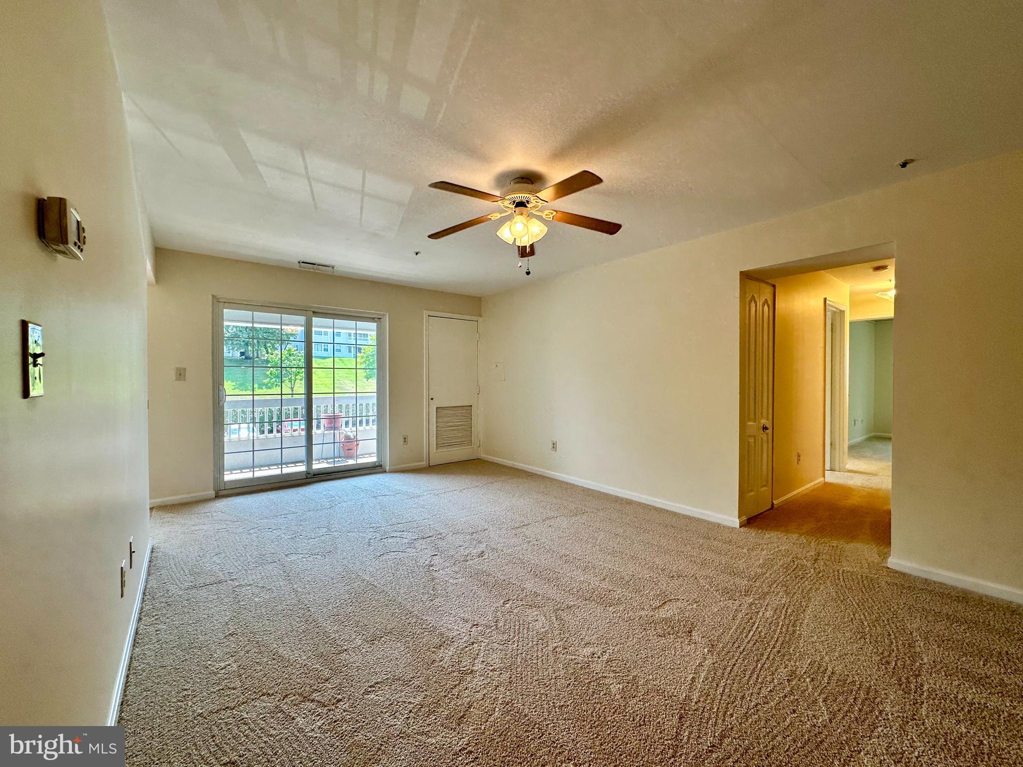 8493 Falls Run Road, Unit D Ellicott City, MD 21043 - Photo 16 of 44 Living room w/ brand new carpet/paint, ceiling fan
