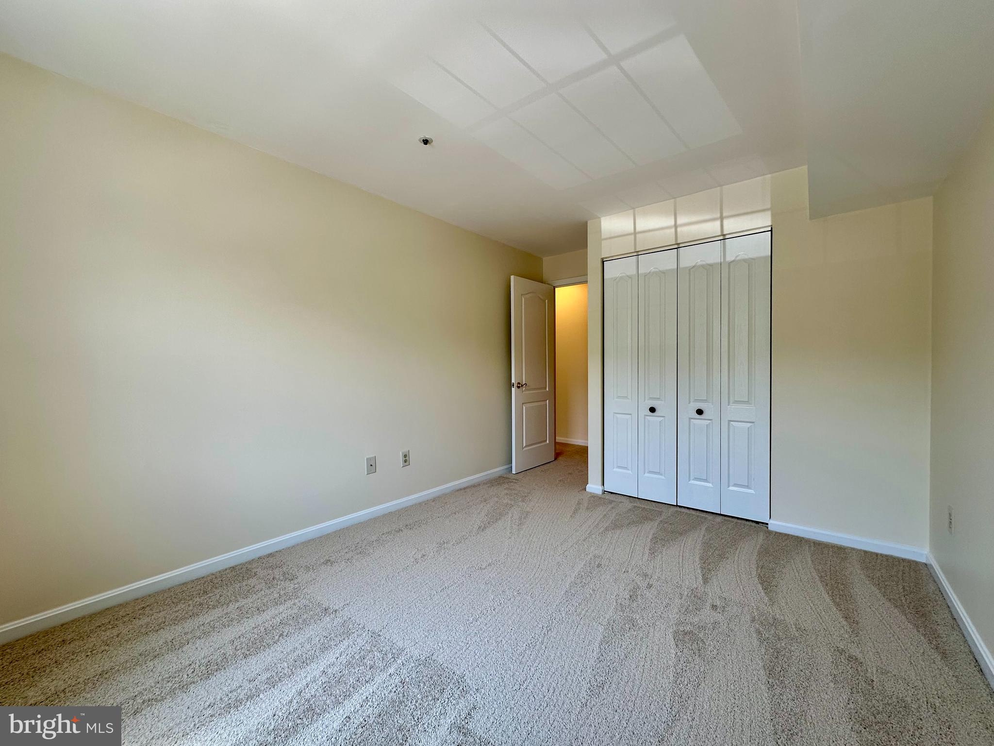 8493 Falls Run Road, Unit D Ellicott City, MD 21043 - Photo 24 of 44 Bedroom 2 with brand new carpet, paint