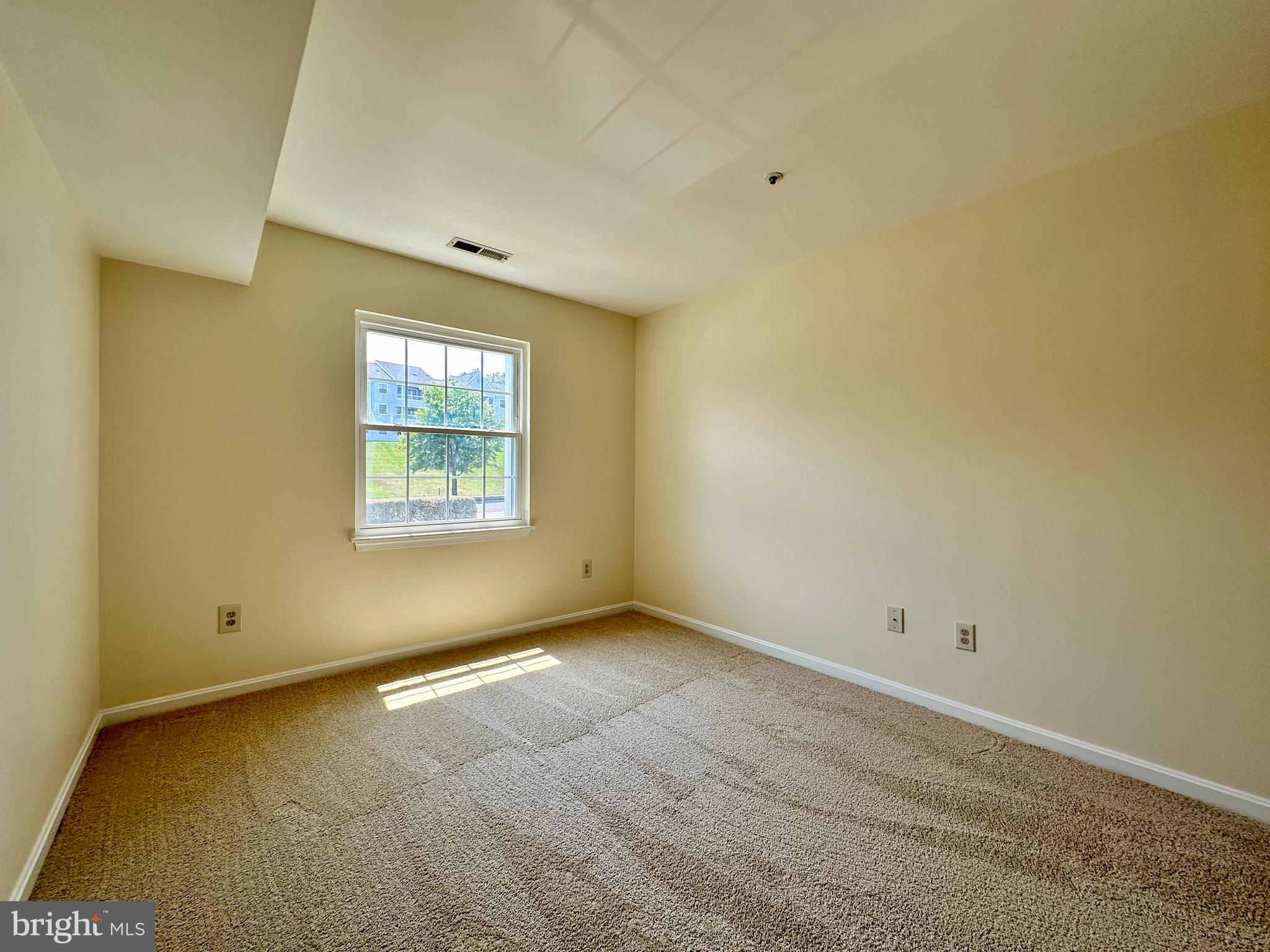 8493 Falls Run Road, Unit D Ellicott City, MD 21043 - Photo 25 of 44 Bedroom 2 with brand new carpet, paint