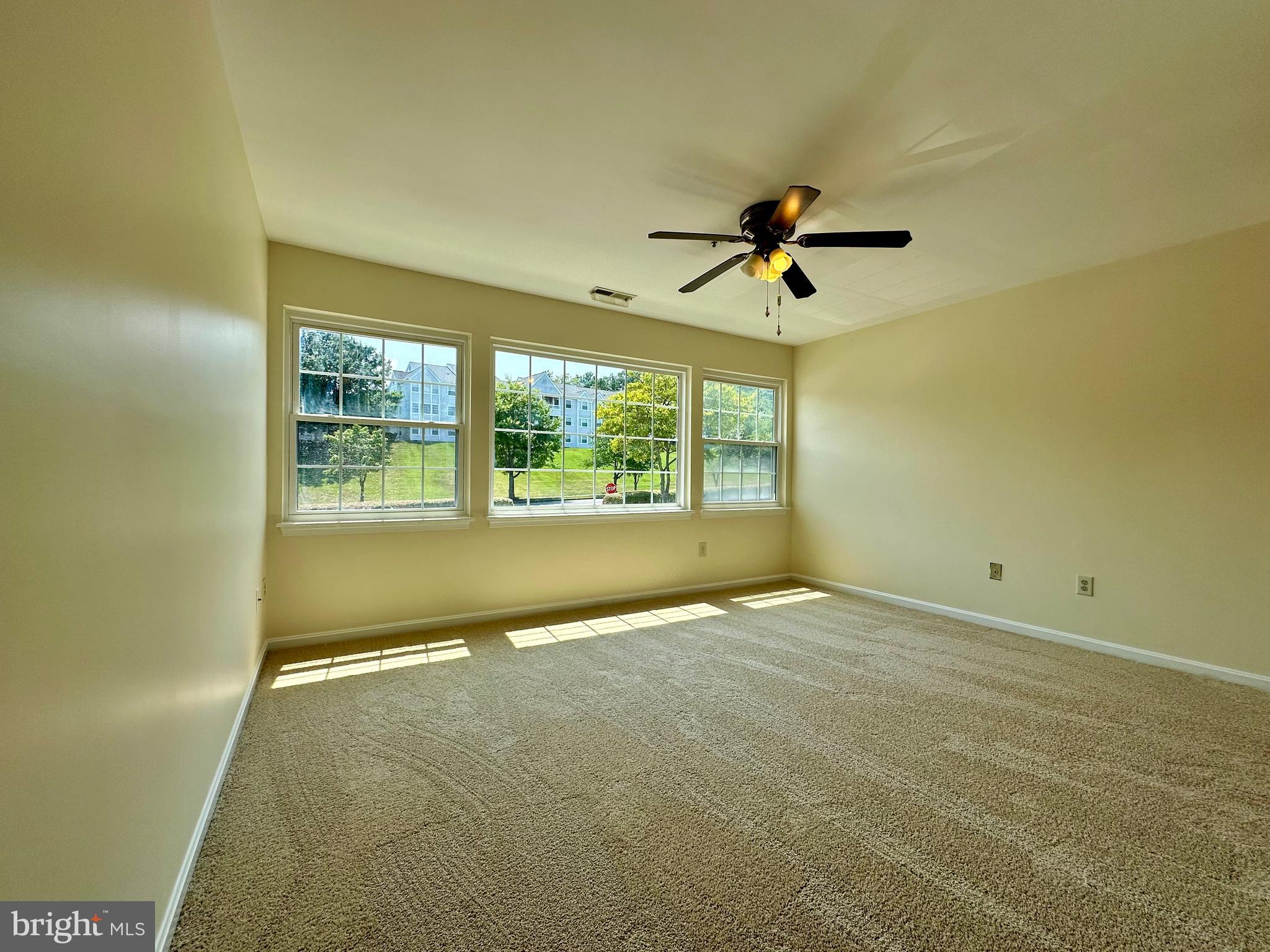 8493 Falls Run Road, Unit D Ellicott City, MD 21043 - Photo 30 of 44 Primary bedroom w/ new carpet, paint, en-suite
