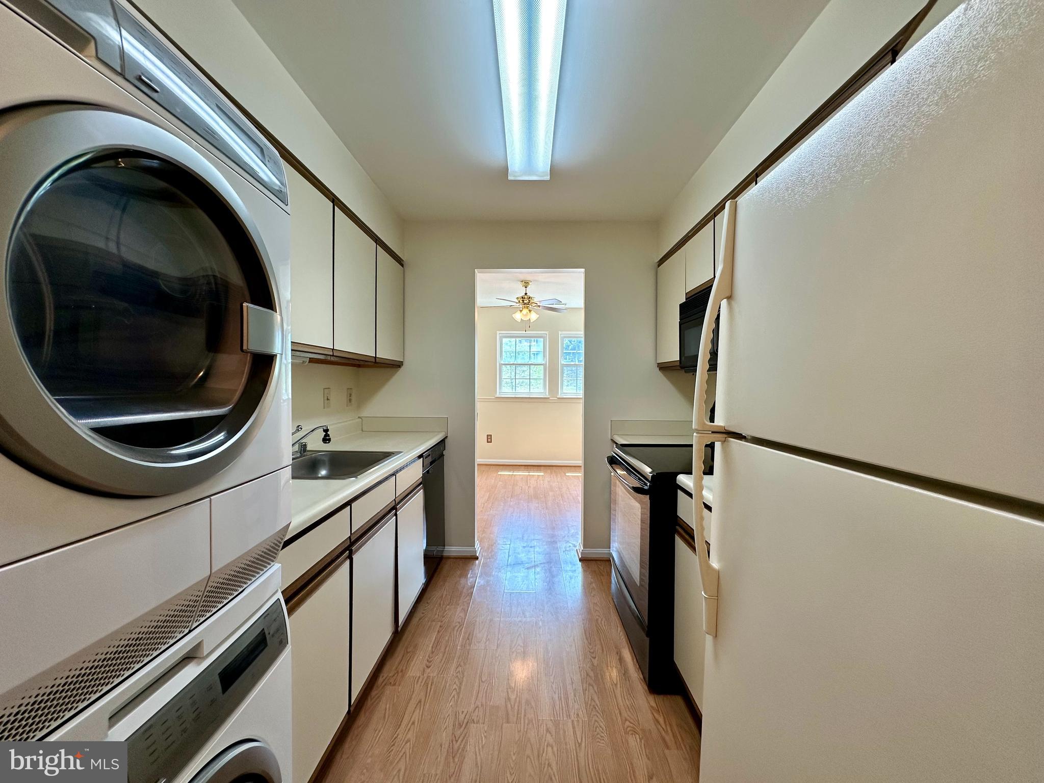 8493 Falls Run Road, Unit D Ellicott City, MD 21043 - Photo 4 of 44 Galley kitchen with convenient laundry
