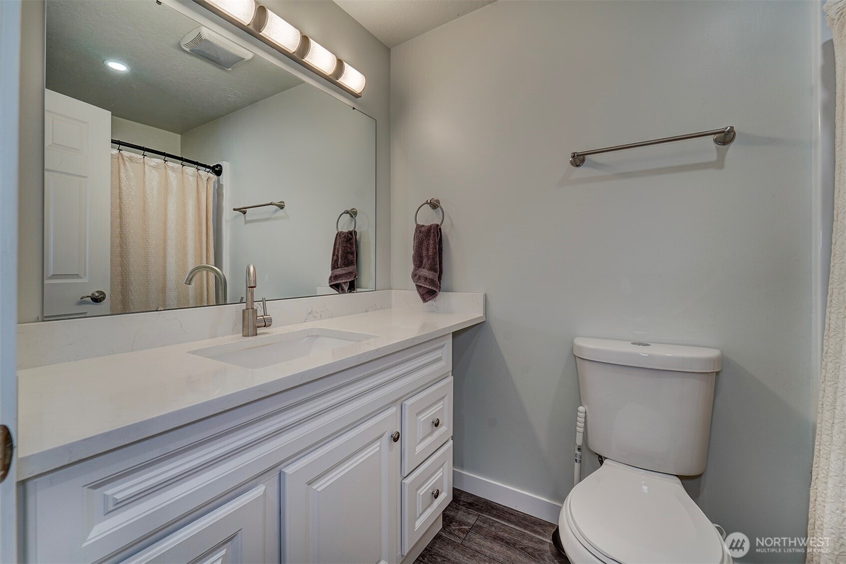 4931 Knute Anderson Road Northwest Silverdale, WA 98383 - Photo 15 of 37 a bathroom with a toilet a sink and mirror