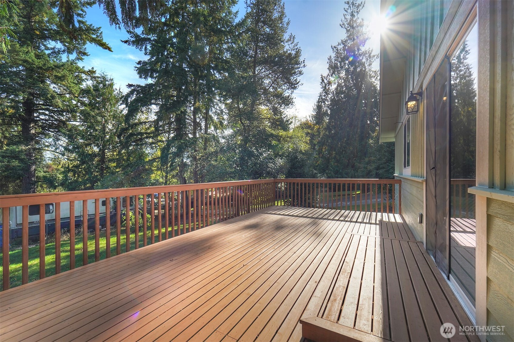 4931 Knute Anderson Road Northwest Silverdale, WA 98383 - Photo 29 of 37 a view of balcony with wooden floor and fence
