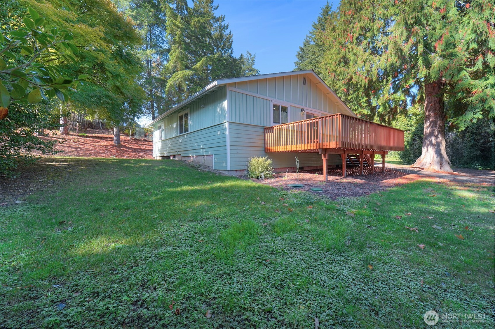 4931 Knute Anderson Road Northwest Silverdale, WA 98383 - Photo 34 of 37 a view of a house with a yard porch and sitting area