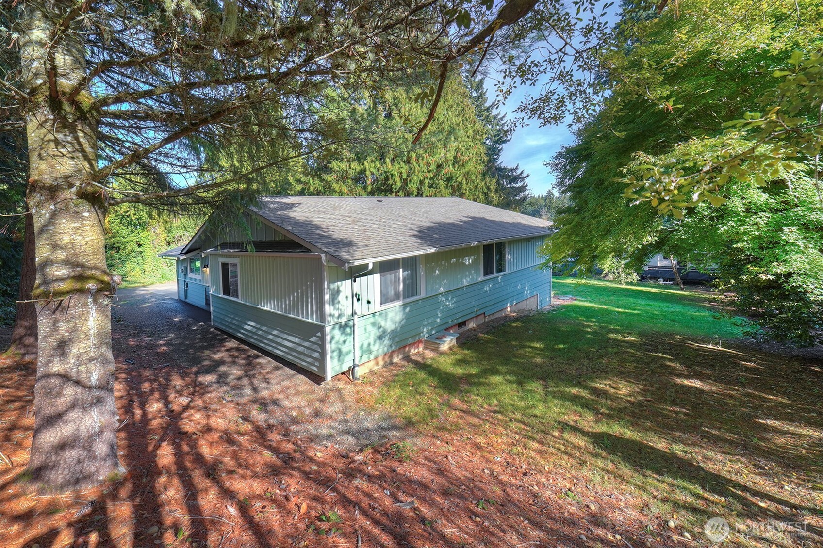 4931 Knute Anderson Road Northwest Silverdale, WA 98383 - Photo 36 of 37 a view of a house with a yard