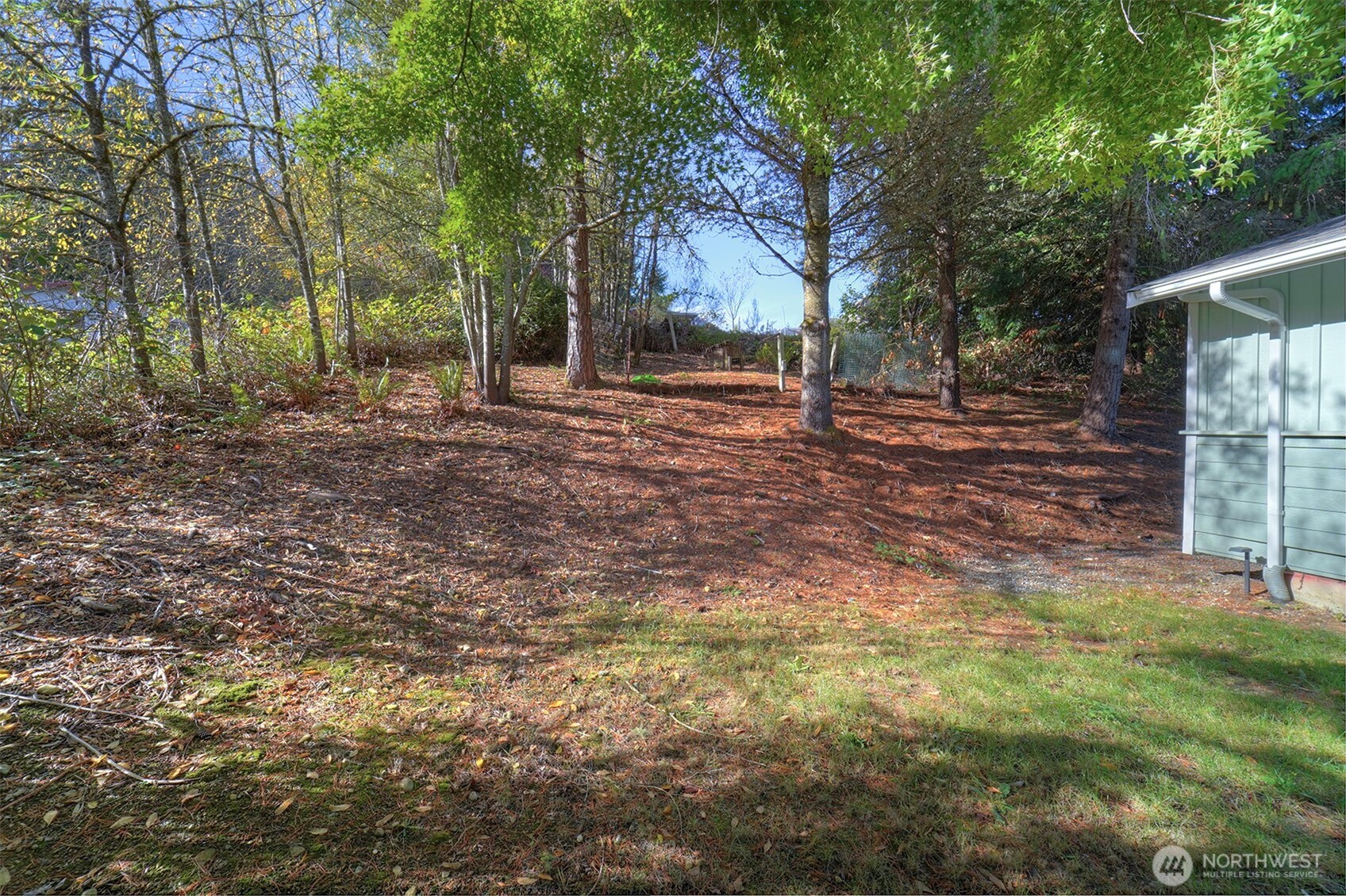4931 Knute Anderson Road Northwest Silverdale, WA 98383 - Photo 37 of 37 a view of a yard with plants and trees