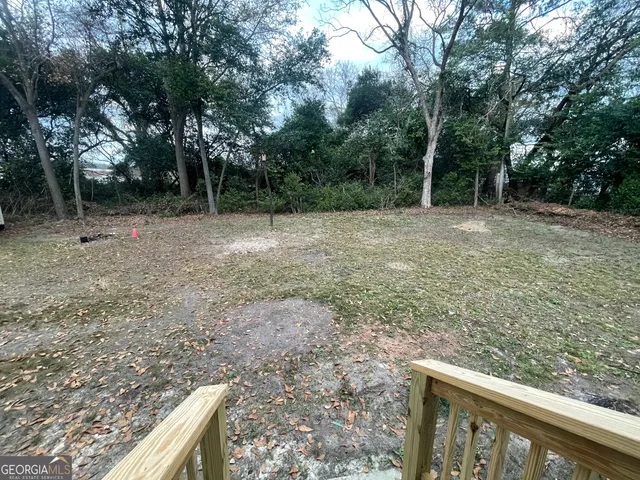 a view of a forest with trees