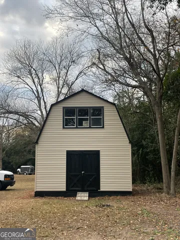 a house with trees in front of it