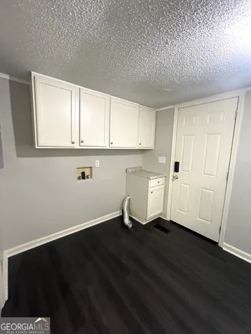 a view of kitchen with wooden floor