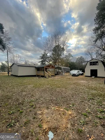 a view of a couches in the middle of a yard