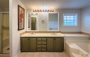 3627 North Katy Road Ross, TX 76640 - Photo 27 of 31 a bathroom with a granite countertop sink and a mirror
