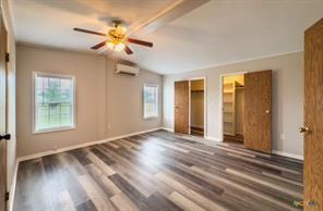3627 North Katy Road Ross, TX 76640 - Photo 28 of 31 a view of an empty room with window and wooden floor