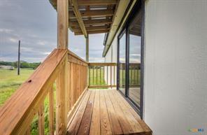 3627 North Katy Road Ross, TX 76640 - Photo 4 of 31 a view of balcony with wooden floor and fence
