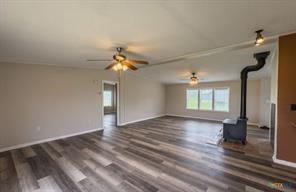 3627 North Katy Road Ross, TX 76640 - Photo 9 of 31 a view of an empty room with wooden floor and a window