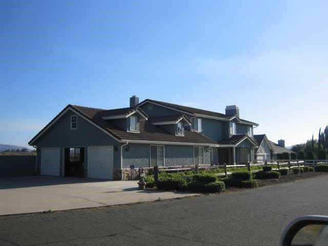 0 Avenida Estrada Temecula, CA 92591 - Photo 5 of 8 a front view of a house with a yard