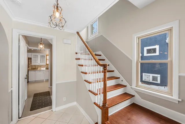 a view of entryway and hall with a front door