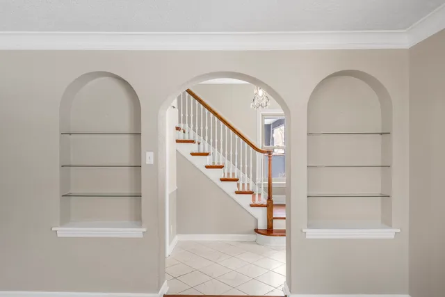 a view of front door with staircase