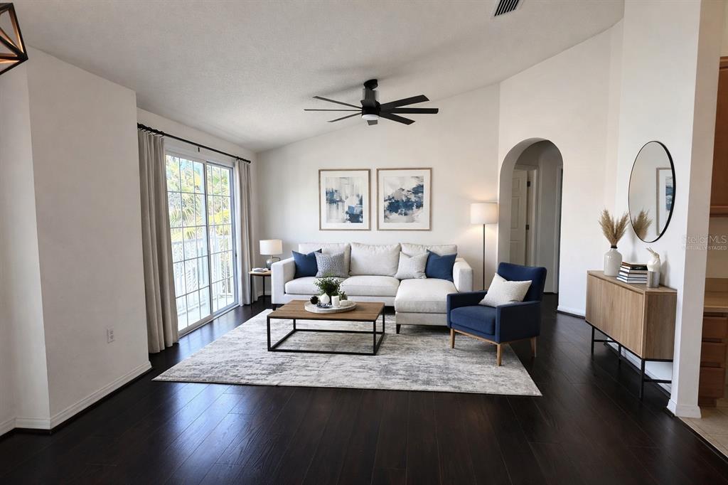 5318 Anhinga Trail New Port Richey, FL 34653 - Photo 3 of 17 a living room with furniture a window and wooden floor